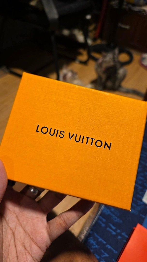 Louis Vuitton Monogram Empreinte Black Leather Wallet (Category: Luxury Bags & Wallets) located in Manila. Submitted by arjuanny (Listing ID 1466316747, Image 1). Description: Master Copy Black leather bifold wallet with debossed Monogram pattern. Center features the LV initials logo. Textured pebbled grain surface all over. Comes packaged inside the original orange Louis Vuitton gift box. Compact size, fits easily in pockets..