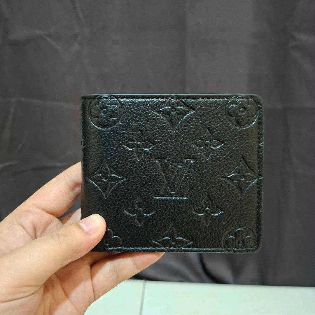 Louis Vuitton Monogram Empreinte Black Leather Wallet (Category: Luxury Bags & Wallets) located in Manila. Submitted by arjuanny (Listing ID 1466316747, Image 2). Description: Master Copy Black leather bifold wallet with debossed Monogram pattern. Center features the LV initials logo. Textured pebbled grain surface all over. Comes packaged inside the original orange Louis Vuitton gift box. Compact size, fits easily in pockets..