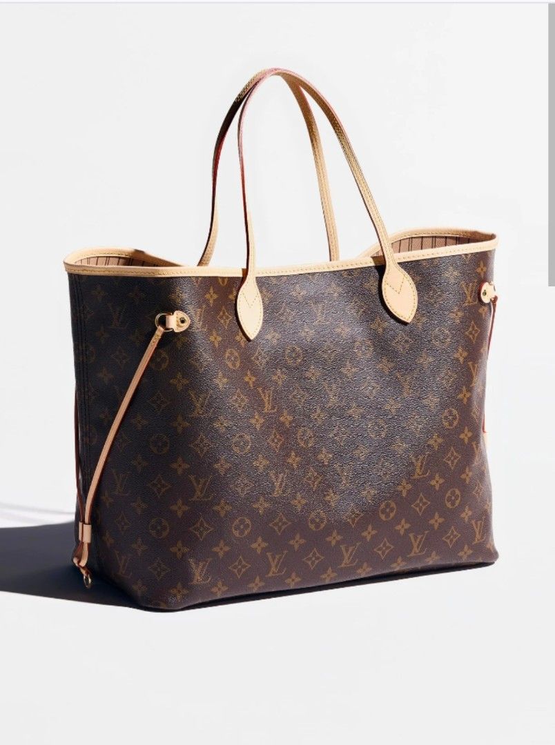 Louis Vuitton Monogram Neverfull MM Tote Bag (Category: Luxury Bags & Wallets) located in Manila. Submitted by warmhawk_a9508d (Listing ID 1466236218, Image 1). Description: - Authentic classic monogram canvas tote - Features natural cowhide leather trim and slim shoulder straps - Adjustable side laces to change the bag's shape - Open top design with a striped textile lining - Spacious interior, fits a laptop and daily essentials - Timeless desig
