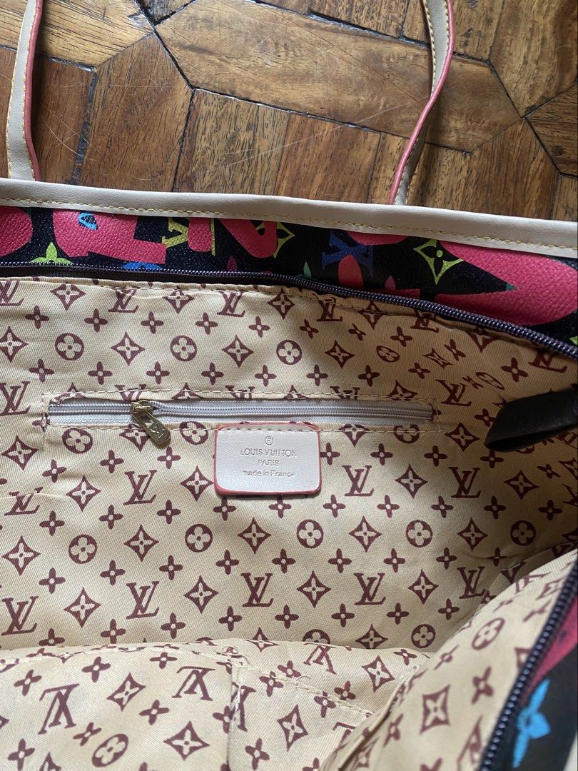 Louis Vuitton Paris Multicolor Monogram Tote Bag (Category: Luxury Bags & Wallets) located in Manila. Submitted by anthony1723 (Listing ID 1466172482, Image 3). Description: - Brand: Louis Vuitton - Design: Vibrant pink Paris lettering and colorful monogram motifs on a black surface - Straps & Trim: Double shoulder straps with matching pink trim - Closure & Interior: Secure top zip closure, interior zip pocket, and classic LV-printed tan lining -