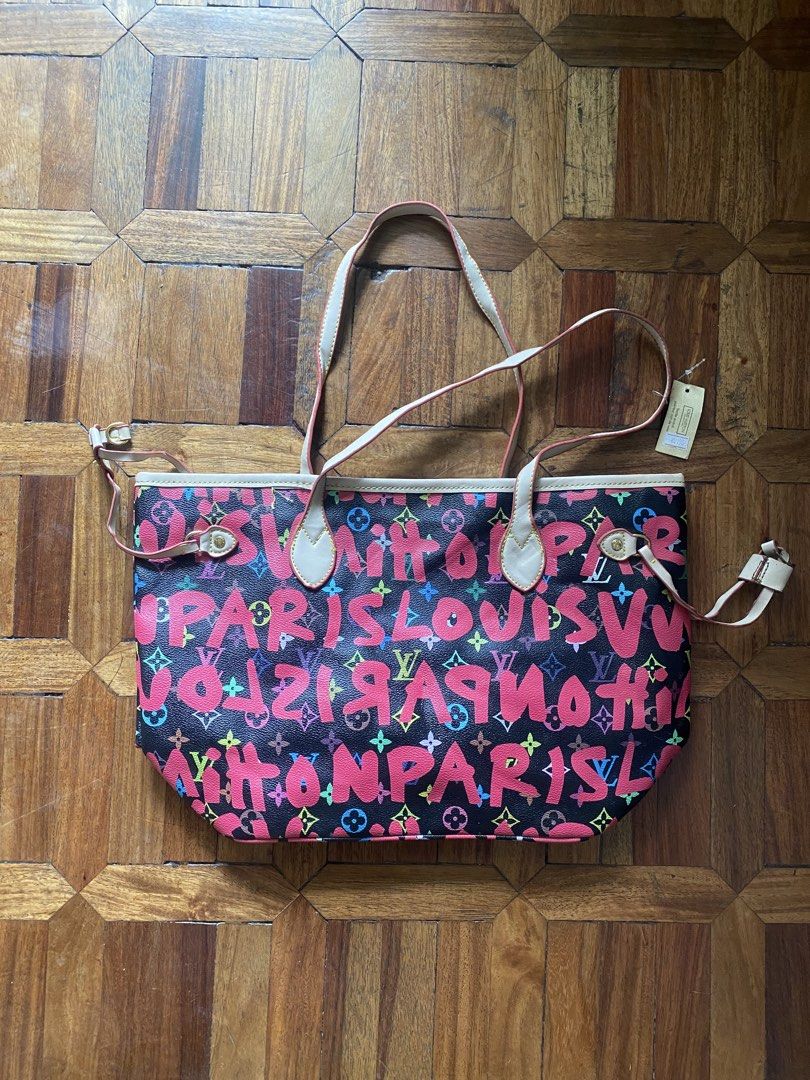 Louis Vuitton Paris Multicolor Monogram Tote Bag (Category: Luxury Bags & Wallets) located in Manila. Submitted by anthony1723 (Listing ID 1466172482, Image 1). Description: - Brand: Louis Vuitton - Design: Vibrant pink Paris lettering and colorful monogram motifs on a black surface - Straps & Trim: Double shoulder straps with matching pink trim - Closure & Interior: Secure top zip closure, interior zip pocket, and classic LV-printed tan lining -