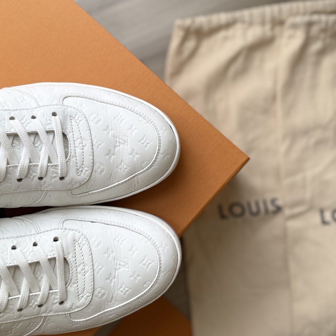 LOUIS VUITTON RIVOLI SNEAKER | WHITE MINI MONOGRAM | PRISTINE CONDITION (Category: Sneakers) located in Manila. Submitted by lessismore_9x (Listing ID 1466235238, Image 3). Description: LOUIS VUITTON RIVOLI SNEAKER | WHITE MINI MONOGRAM A refined Louis Vuitton Rivoli Sneaker in an elegant monochrome white colorway, featuring the signature Mini Monogram pattern embossed throughout the calf leather upper. The classic low-top silhouette, clean tonal
