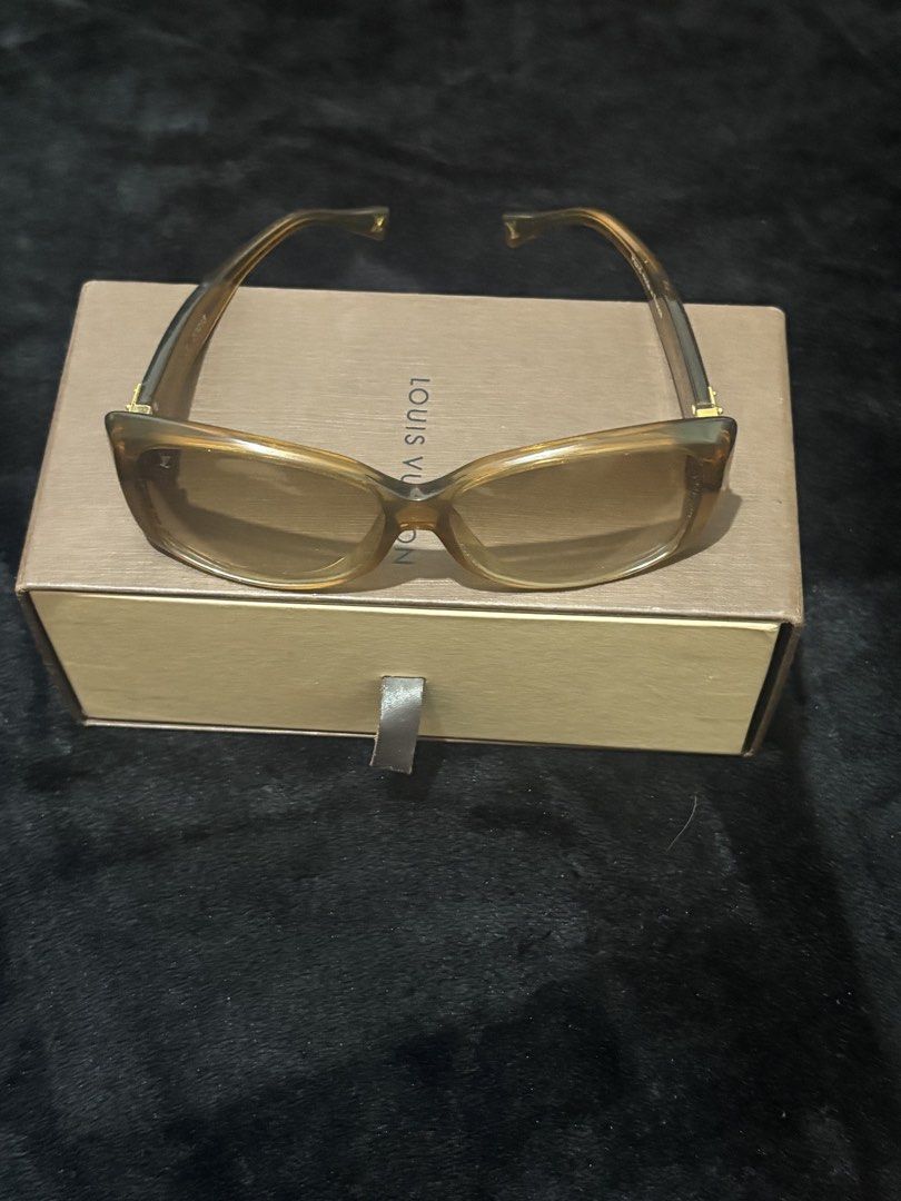 Louis Vuitton Z0003E Sunglasses Brown (Category: Sunglasses & Eyewear) located in Manila. Submitted by nykji96 (Listing ID 1466171195, Image 1). Description: - Authentic Louis Vuitton sunglasses, model Z0003E - Color: Elegant brown with gradient brownish lenses - Subtle LV signature logo near the corner of the lens - Premium gold-tone hardware accents at the hinges - Size: 57[]13 - Serial number and 'Hand made in France' printed inside the temple