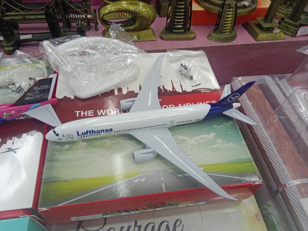 Lufthansa Airplane Model with Stand and Box (Category: Vehicle & Diecast Models) located in Manila. Submitted by iliasjen3082126 (Listing ID 1466244316, Image 1). Description: - Authentic Lufthansa diecast airplane model - Includes display stand and landing gear parts in sealed plastic bags - Features detailed markings along the fuselage and wings - Comes in original box with a runway graphic cover - Perfect collectible piece for aviation fans an