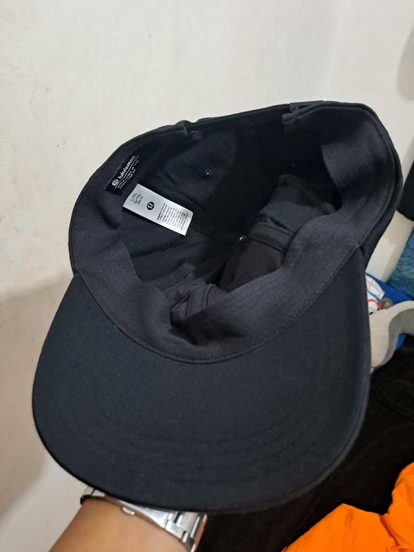 Lululemon Black Adjustable Cap S (Category: Caps & Hats) located in Puerto Princesa. Submitted by jercksthriftph (Listing ID 1466330187, Image 3). Description: - Brand: Lululemon - Color: Black - Size: L/XL (Fits ~58cm head circumference) - Material: Cotton and nylon blend - Design: Classic curved brim, structured panels, adjustable strap back with branded metal slider - Condition: Clean, excellent overall condition with minimal wear inside and o