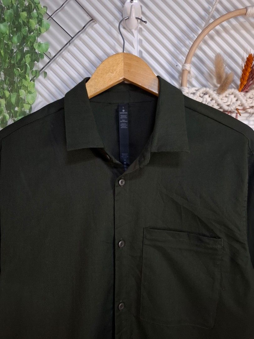 Lululemon Commission Button-Down Shirt Size L (Category: Luxury Apparel) located in Bulacan. Submitted by cathycampo51092 (Listing ID 1466244855, Image 1). Description: - Brand: Lululemon - Style: Button-down shirt with regular collar and front buttons - Color: Dark Green - Size: Large (Chest: 22 inches, Length: 29 inches) - Features: Single chest pocket with an inner hidden zipper compartment - Material: 100% polyester body, 86% recycled polyest