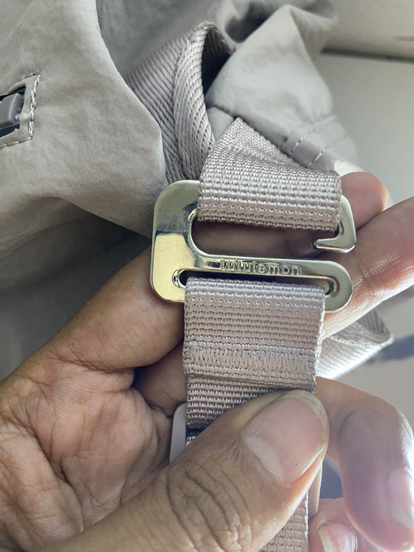 Lululemon Crossbody Bag Light Grey Nylon (Category: Cross-body Bags) located in Manila. Submitted by onfleekapparelph (Listing ID 1466168676, Image 3). Description: - Brand: Lululemon - Style: Crossbody Bag - Material: Durable light grey nylon - Hardware: Premium metallic hardware with adjustable shoulder strap - Pockets: Front diagonal zipper pocket and interior zipper pocket - Details: Features branded pull tab and white Lululemon fabric logo t