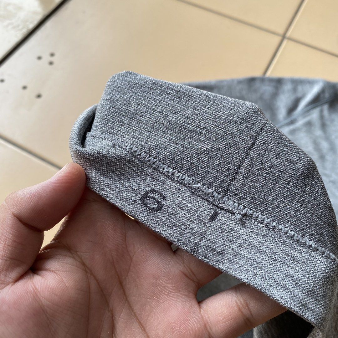 Lululemon Swiftly Tech Short Sleeve Crew Grey Size 6 (Category: Shirts) located in Bogo. Submitted by royalivio069630 (Listing ID 1466172662, Image 3). Description: Grey short sleeve athletic top from Lululemon. Size 6 printed inside the hem. Seamless knit fabric with textured detailing down the back and subtle motivational phrases printed near the bottom hem including 'BREATHE. REPEAT.' and 'MOVEMENT IS MEDICINE'. Classic crew neck style, great 