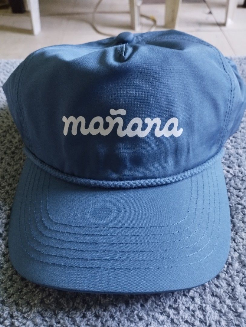 Mañana Blue Rope Snapback Cap (Category: Caps & Hats) located in Manila. Submitted by happycaps (Listing ID 1465859460, Image 2). Description: - Color: Deep blue - Design: 'mañana' printed in white across the front - Details: Braided rope accent along the brim - Construction: Structured crown with top button - Condition: Clean, excellent, and ready to wear - Snapback.