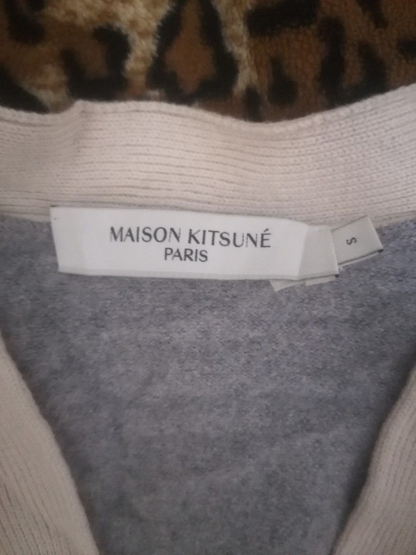 Maison Kitsune Paris Grey Wool Cardigan (Category: Coats, Jackets and Outerwear) located in Cebu City. Submitted by roadthrift (Listing ID 1466163018, Image 3). Description: Maison Kitsuné Paris grey wool cardigan. Size S. Contrast white button placket, cuffs, and hem. Button-down front with two front pockets. Embroidered fox patch on the chest. Made from 100% wool. Hand wash only..