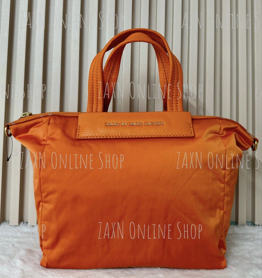 Marc by Marc Jacobs Orange Nylon Tote Bag (Category: Tote Bags) located in Santa Cruz. Submitted by za2011za (Listing ID 1466287703, Image 1). Description: 100% Authentic/Original Buy with confidence 👌👌👌 LEGIT seller since 2011, sold over thousand items (Please see all sold items) Actual photos displayed Shipping thru LBC J&T Grab or Lalamove MOP: BDO BPI GCash STRICTLY IMPLEMENTED - NO CANCELLATION - NO RETURN - NO CHANGE ITEM - NO REFUND - B