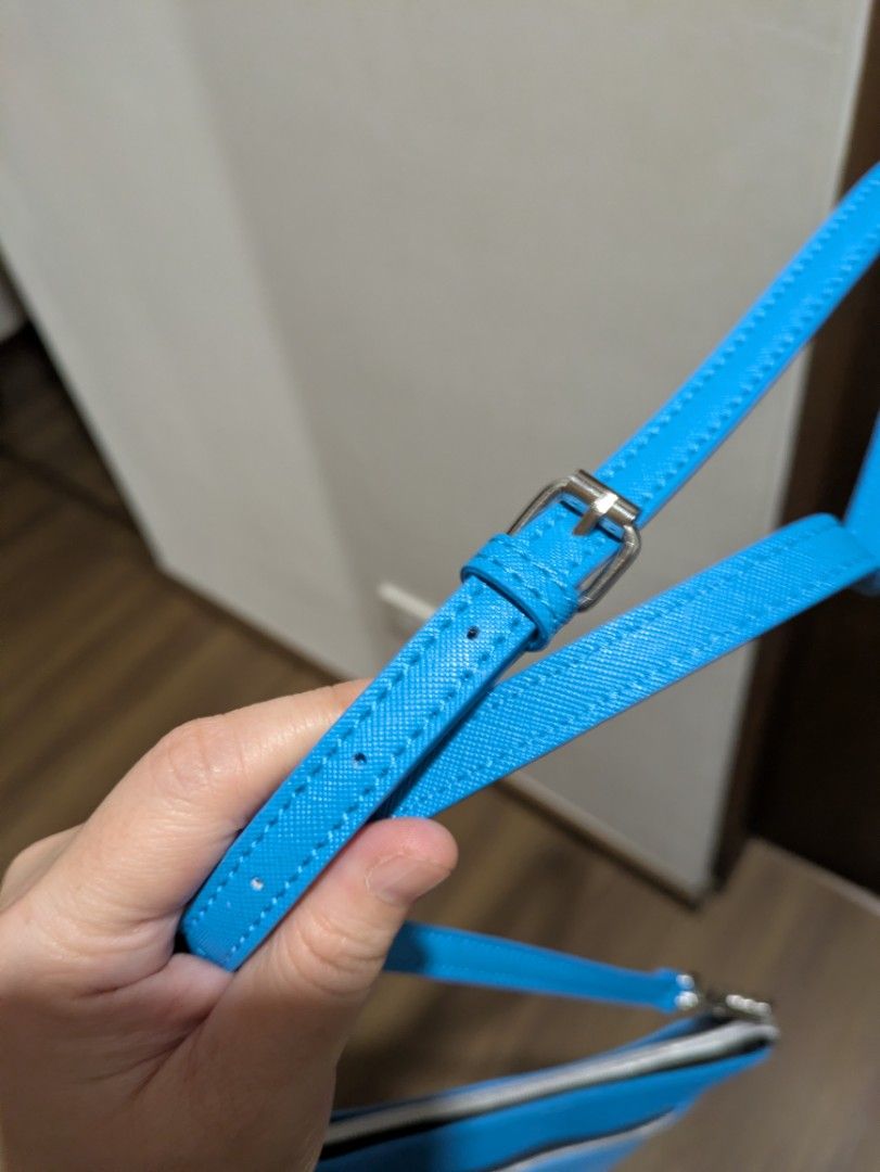 Marc Tetro Blue Schnauzer Slingbag (Category: Cross-body Bags) located in Quezon City. Submitted by countess_86 (Listing ID 1466276319, Image 2). Description: - Brand: Marc Tetro - Color: Bright blue with cute schnauzer graphic on front - Hardware: Silver-tone with chain strap details - Compartments: Secure zippered compartments - Strap: Adjustable with buckle for a custom fit - Condition: Brand new with original tag attached - bought from Canada