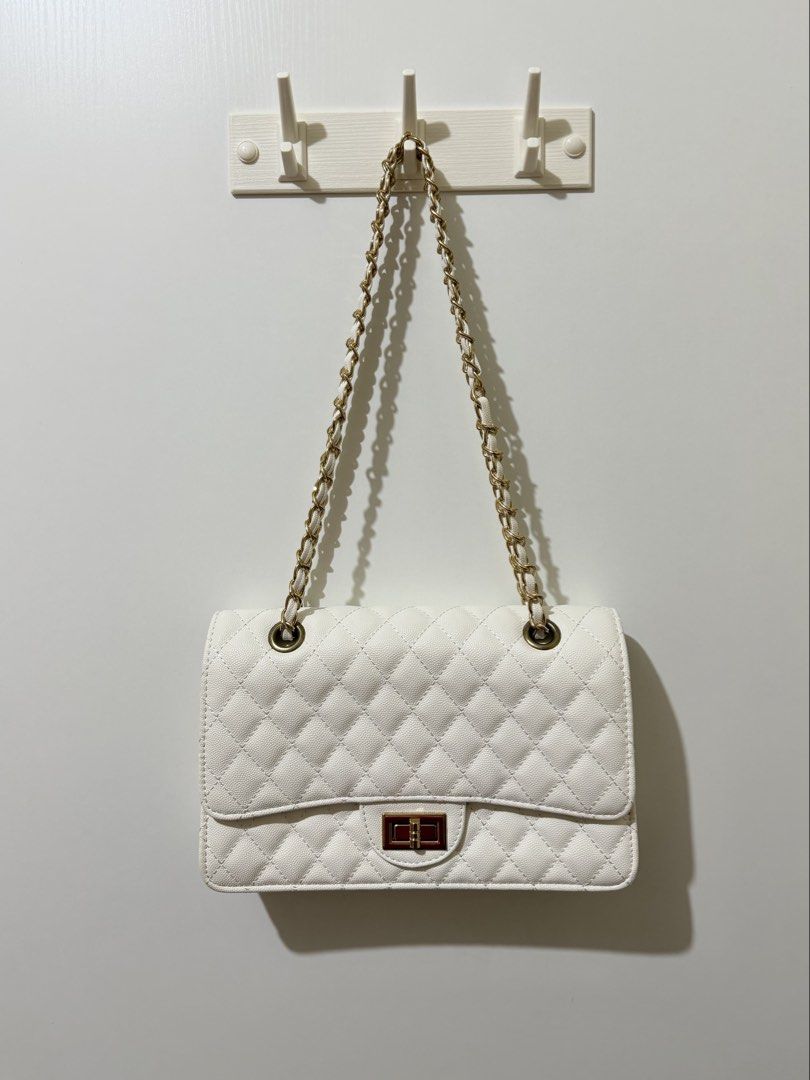 Marikina White Quilted Shoulder Bag with Chain Strap (Category: Shoulder Bags) located in Manila. Submitted by gbrlldeclutters (Listing ID 1466287366, Image 1). Description: please manage your expectations, as this is a preloved item. • marikina white quilted shoulder bag w chain strap • used only a few times • in good preloved condition — yellowing on the sides due to storage but can be cleaned. no peeling • swipe through the photos for a closer