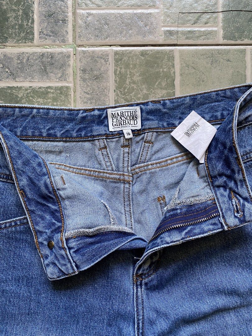 Marithe Francois Girbaud Denim Jeans Size 26 (Category: Jeans) located in Cotabato. Submitted by thewalfinds.ph (Listing ID 1466183171, Image 3). Description: Marithe Francois Girbaud blue denim jeans. Size 26 tag inside. High-waisted cut with unique angled yoke seams on front and back. Brown leather brand patch on back waistband. Metal button closure and zipper fly. Standard five-pocket setup with deep back pockets. Classic straight leg silhouet