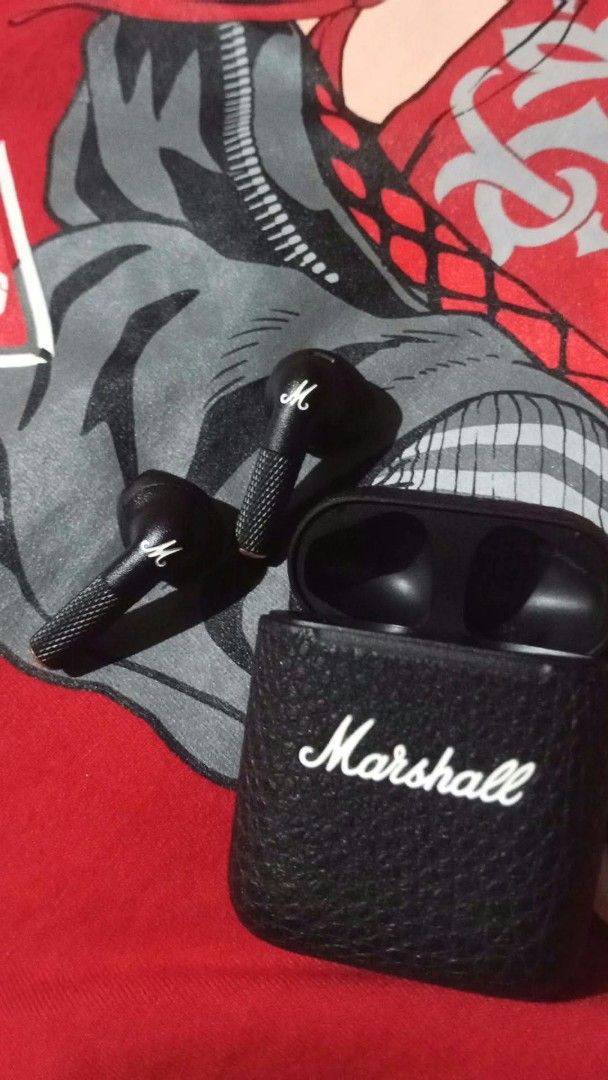 Marshall wireless earbuds with charging case (Category: Earphones) located in Valenzuela. Submitted by rafvits (Listing ID 1466302822, Image 2). Description: - Authentic Marshall wireless earbuds in sleek black - Textured charging case featuring the iconic white logo branding - Earbuds designed with the classic script logo and textured stem - Delivers great sound quality for everyday music listening - Clean condition and charges properly.