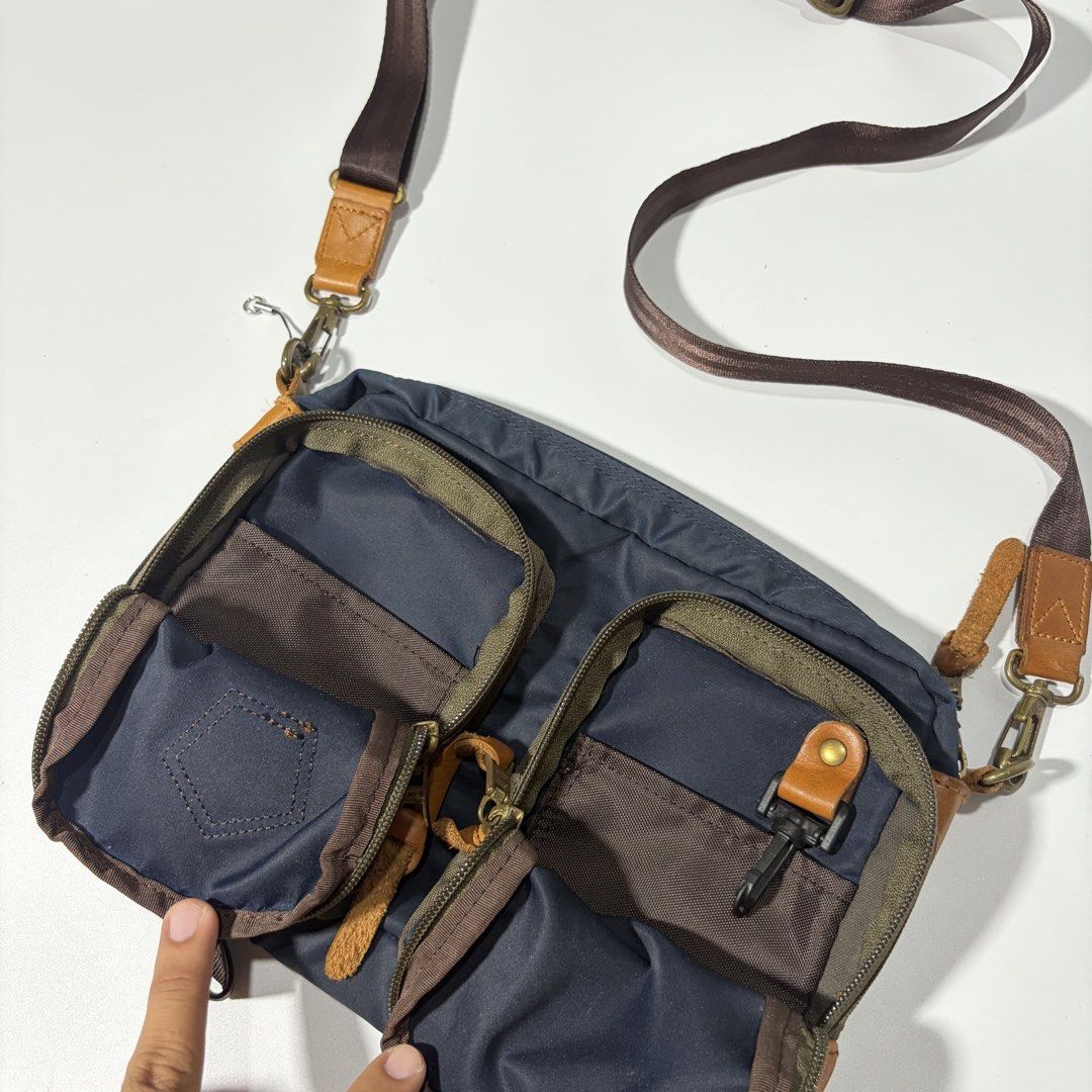 masterpiece / master-piece MSPC "CUBE" Shoulder Bag, a utilitarian messenger-style sling bag (Category: Sling Bags) located in Magalang. Submitted by luxgood18 (Listing ID 1466199964, Image 3). Description: • Brand: master-piece (MSPC) — A renowned high-end Japanese bag brand known for marrying premium materials with urban functional wear. • Model: CUBE Series (Model No. 02772). • Design Features: The bag is constructed from highly durable navy n