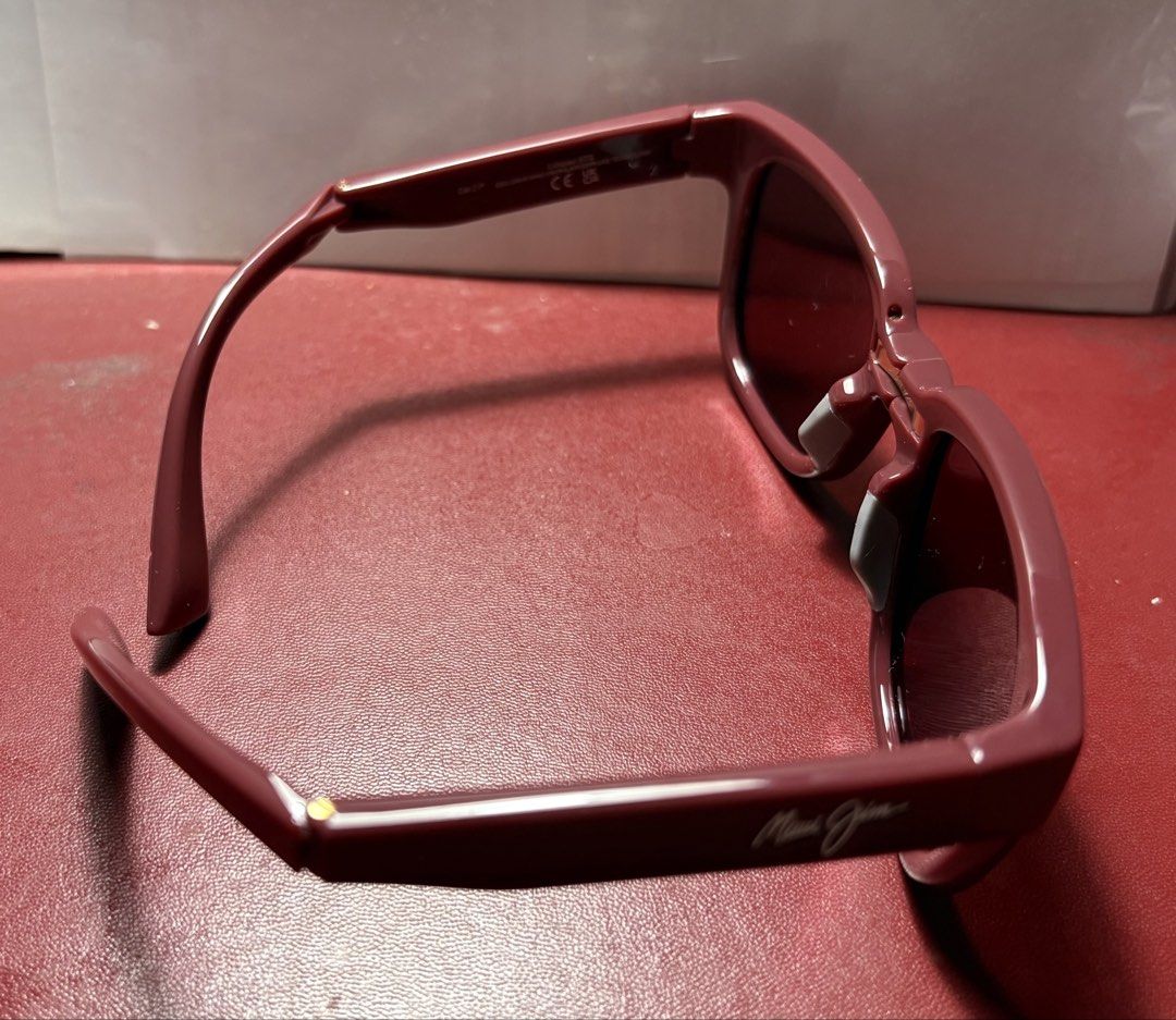Maui Jim MJ0673S PolarizedPlus2 Sunglasses (Category: Sunglasses & Eyewear) located in Paranaque City. Submitted by heisam99 (Listing ID 1466315518, Image 3). Description: - Brand: Maui Jim - Model: MJ0673S - Color: Maroon frames with polarized lenses - Size: 52-22-140 XL - Origin: Made in Italy - Condition: Pristine, zero scratches on lenses or frames, ready to wear - Inclusions: Original tropical box and paperwork included.