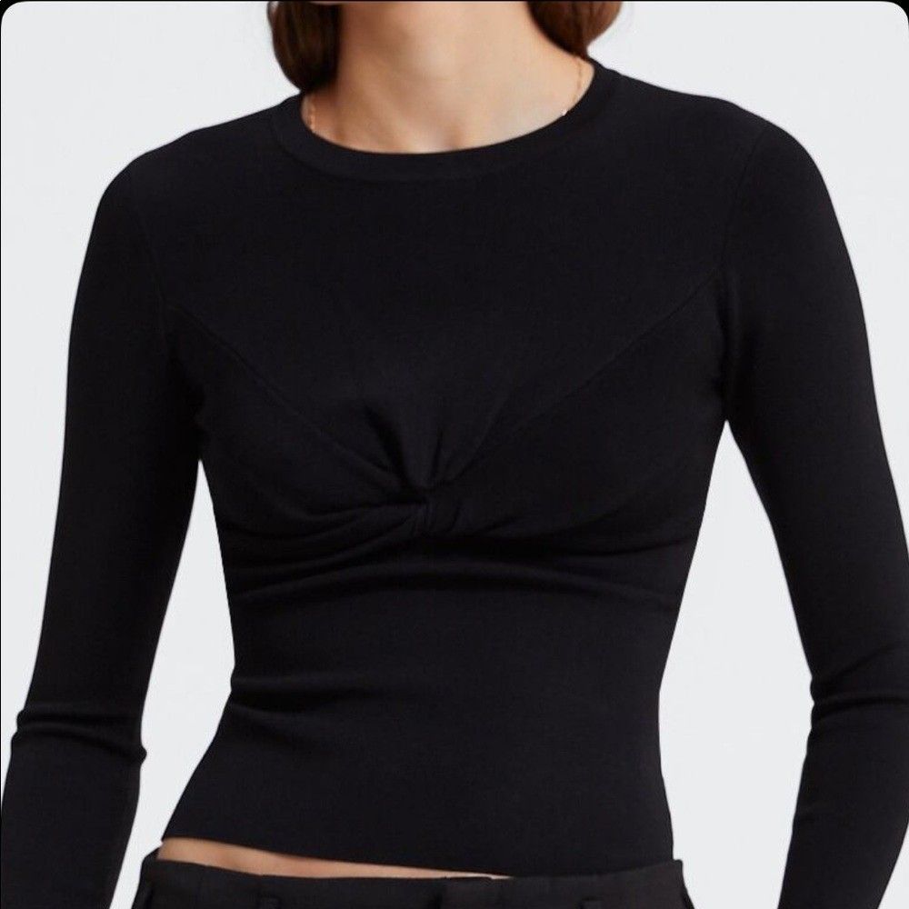 Medium - Zara Black Knit Sweater with Knot (Category: Others Tops) located in Castillejos. Submitted by lalainecloset22 (Listing ID 1466179623, Image 2). Description: - Brand: Zara - Size: Medium (EUR/USA/MEX M) - Color: Classic Black - Material: Comfortable ribbed knit - Design: Long sleeves, crew neck, and stylish front knot twist detail - Condition: Excellent, well-maintained pre-loved condition - Perfect for casual outings, smart-casual offic