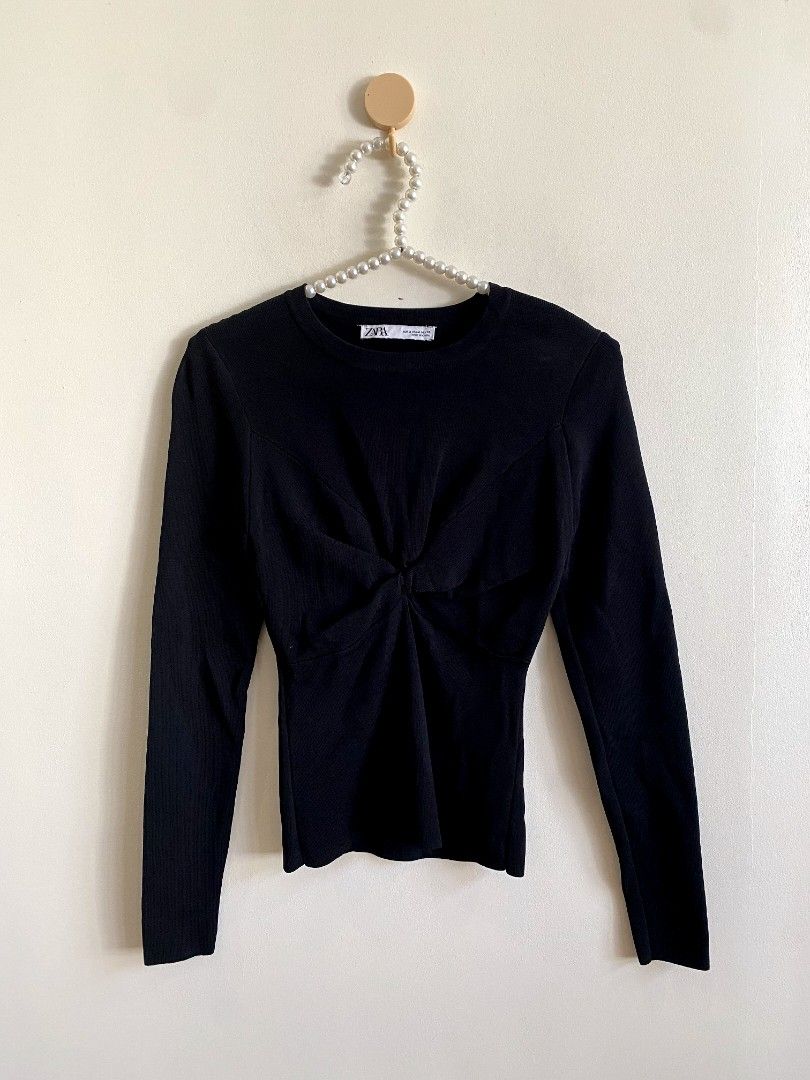 Medium - Zara Black Knit Sweater with Knot (Category: Others Tops) located in Castillejos. Submitted by lalainecloset22 (Listing ID 1466179623, Image 3). Description: - Brand: Zara - Size: Medium (EUR/USA/MEX M) - Color: Classic Black - Material: Comfortable ribbed knit - Design: Long sleeves, crew neck, and stylish front knot twist detail - Condition: Excellent, well-maintained pre-loved condition - Perfect for casual outings, smart-casual offic