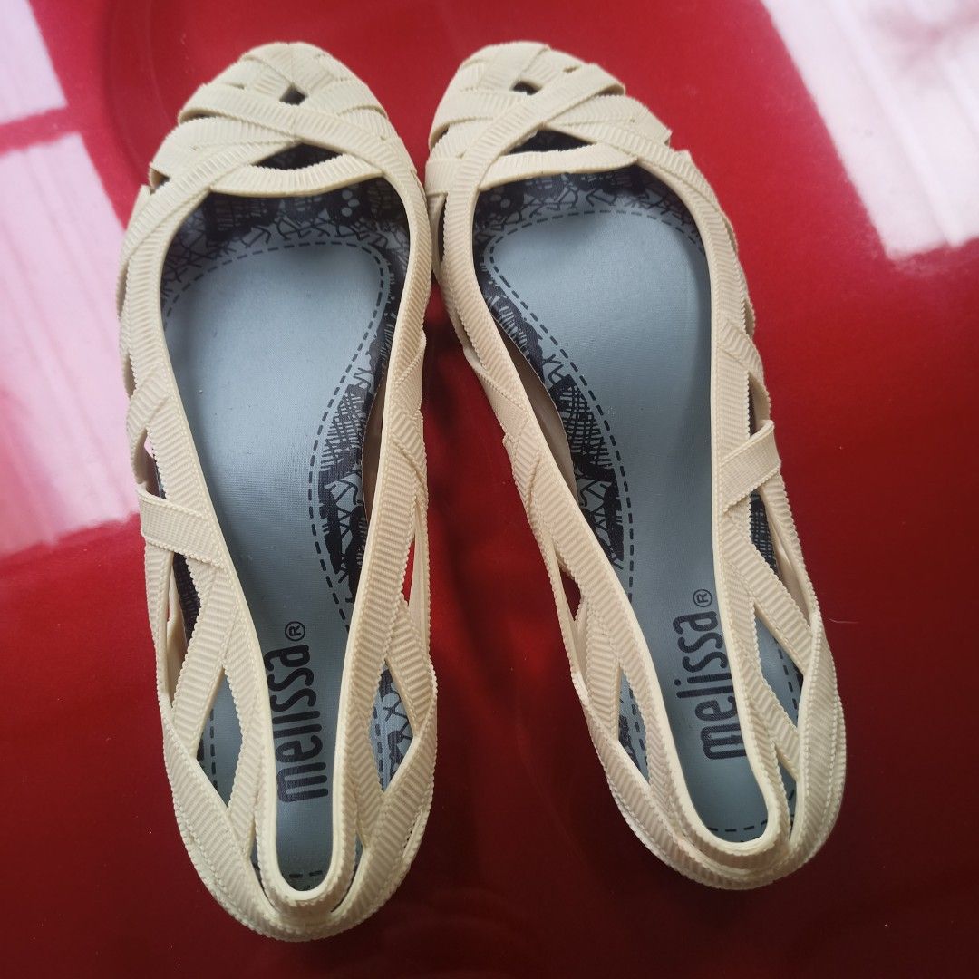 Melissa Cream Jelly Flats Size US 5 (Category: Flats & Sandals) located in Paranaque City. Submitted by jzet23 (Listing ID 1466203096, Image 1). Description: - Brand: Melissa - Style: Jelly flats with woven strap design and slip-on style - Color: Cream with cute lace-print insoles - Size: USA 5, EUR 36, JPN 22.5 - Condition: Pre-loved with significant cracking and damage on the bottom sole of one shoe - Perfect for casual days or beach trips at a
