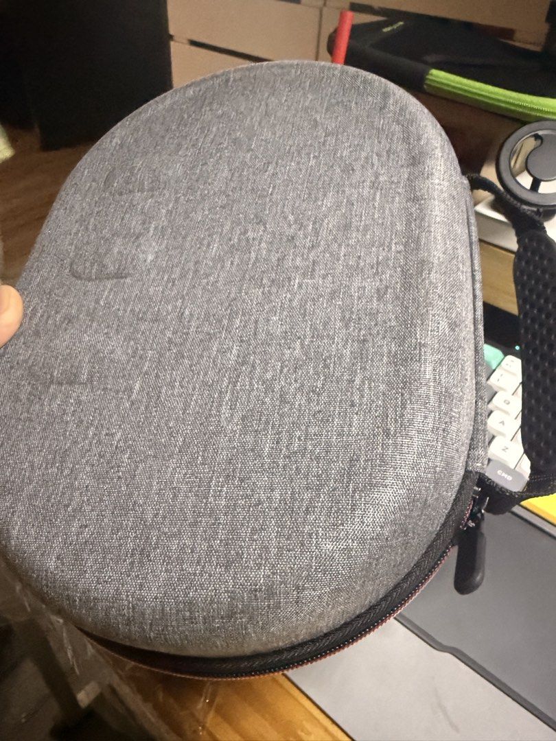 Meta Quest 3 VR Grey Hard Shell Carrying Case with Storage Compartments (Category: Cases & Sleeves) located in Manila. Submitted by unnamednameless (Listing ID 1466233989, Image 3). Description: - Color/Finish: Grey textured hard shell - Interior: Fitted compartment with two elastic retention straps - Storage: Inner zip mesh pocket for accessories - Closure: Sturdy all-around zipper - Use: Perfect for protecting gear while traveling Orig Price: 8