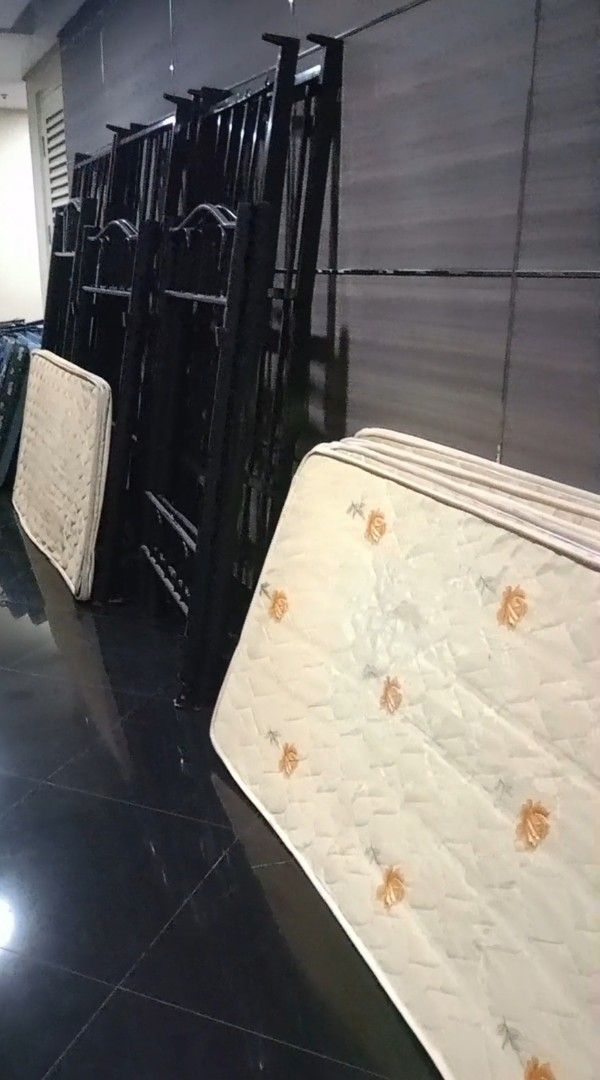 Metal Bed Frames and Mattresses (Category: Bed Frames & Mattresses) located in Manila. Submitted by fastwater.105278 (Listing ID 1466322585, Image 1). Description: - 3 sets Durable black metal double deck - Includes thin mattresses with quilted floral patterns - Ideal for guest rooms, dorms, and rental properties - Available as a bundle or per set - Meet-up or delivery options available — PM to inquire!.