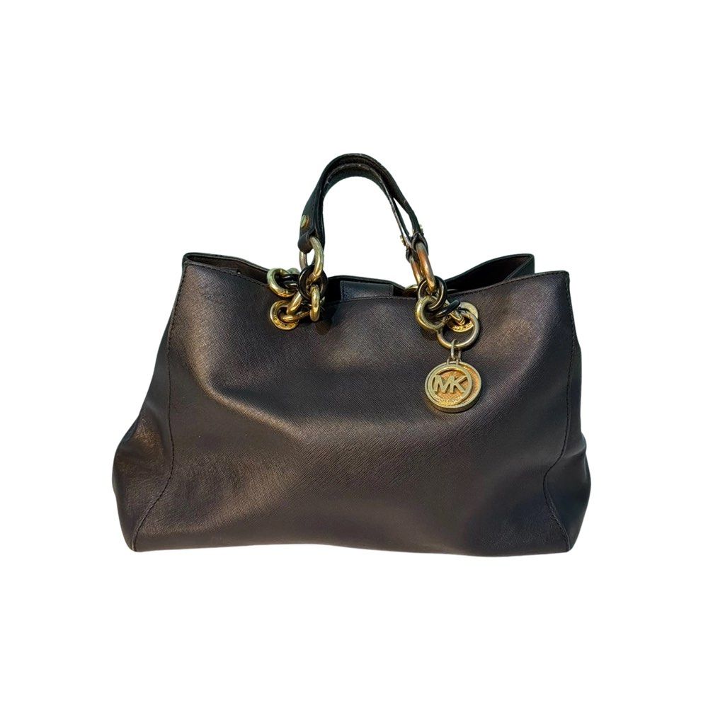 Michael Kors Black Saffiano Chain Tote (Category: Shoulder Bags) located in Binangonan. Submitted by joeydrs06 (Listing ID 1466335521, Image 1). Description: - Brand: Michael Kors - Material: Premium black Saffiano leather - Hardware: Gold-tone chain handles with matching MK circle charm pendant - Interior: Clean fabric lining with spacious open-top compartments - Perfect for: Daily commuting, work, or carrying essentials and documents.