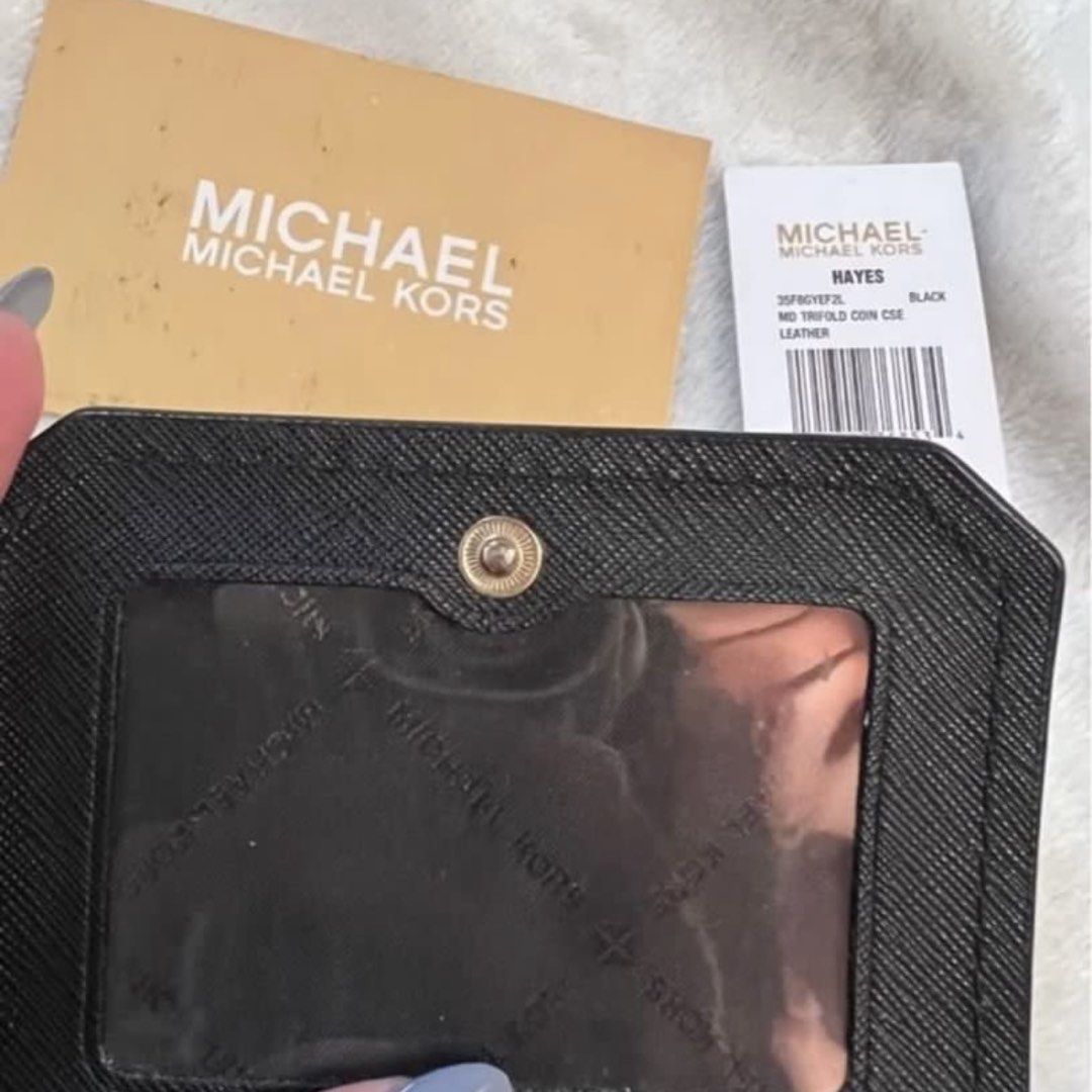 Michael Kors Hayes Trifold Wallet Black (Category: Luxury Bags & Wallets) located in Quezon City. Submitted by claireityyy (Listing ID 1466281138, Image 2). Description: - Brand: Michael Kors Hayes - Style: Medium trifold coin case wallet - Color: Classic Black - Material: Genuine Leather - Features: Interior card slots, clear ID window, secure snap closure - Condition: Brand new with original store tags and care card - Retail Price: $128.