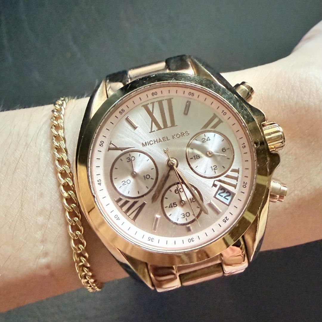 Michael Kors Rose Gold Watch (Category: Women's Watches) located in Manila. Submitted by she_alice (Listing ID 1466327464, Image 1). Description: - Brand: Michael Kors Authentic - Color/Finish: Rose gold tone stainless steel - Dial: Large round dial with Roman numerals, 3 sub-dials, and date display at 4 o'clock - Condition: Noticeable minor scratches on the bezel and bracelet, still in good condition but needs cleaning -Actual pics posted -Bough