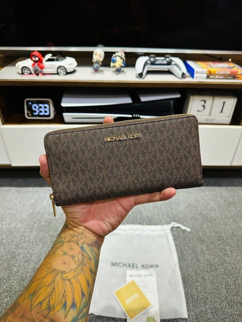 Michael Kors Wallet (Category: Luxury Bags & Wallets) located in Caloocan City. Submitted by raine17 (Listing ID 1466208192, Image 1). Description: - Authentic Michael Kors zip-around long wallet in classic brown monogram print Made in Japan with Receipt Caloocan South Meet up CAMANAVA areas .