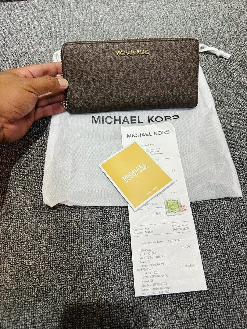 Michael Kors Wallet (Category: Luxury Bags & Wallets) located in Caloocan City. Submitted by raine17 (Listing ID 1466208192, Image 2). Description: - Authentic Michael Kors zip-around long wallet in classic brown monogram print Made in Japan with Receipt Caloocan South Meet up CAMANAVA areas .