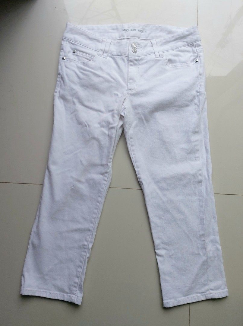 Michael Kors White Cropped Denim Jeans (Category: Jeans) located in Lapu Lapu. Submitted by agnesapm_29813 (Listing ID 1466282192, Image 2). Description: - Brand: Michael Kors - Color: Clean white wash - Fit: Mid-rise cut with standard belt loops - Closure: Unique double button waist - Details: Silver studded detailing on back pocket flaps - Measurements: waist-30 inches on tape measure, height-30 inches .