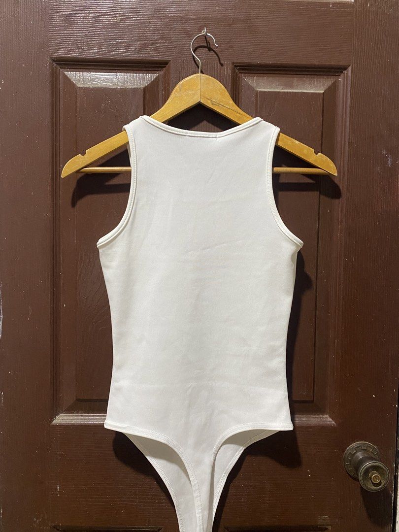 Missguided White Ribbed Bodysuit UK 10 (Category: Sleeveless) located in Calamba. Submitted by soleilcollections.ph (Listing ID 1466237342, Image 3). Description: - Brand: Missguided - Color: White - Style: Classic ribbed tank bodysuit, sleeveless - Size: UK 10 / EUR 38 / US 6 - Condition: Clean and well-maintained - Versatile basic piece, perfect for pairing with jeans or skirts.