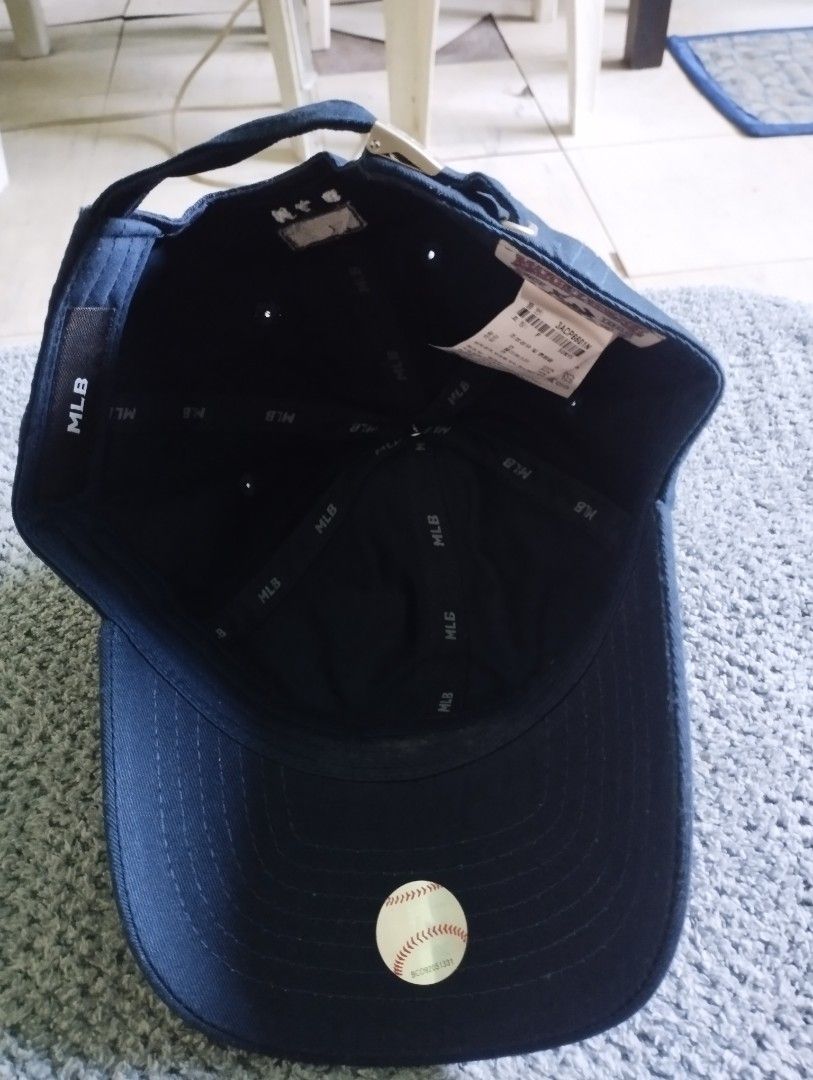 MLB New York Yankees Navy Cap (Category: Caps & Hats) located in Manila. Submitted by happycaps (Listing ID 1466179502, Image 3). Description: - Authentic MLB New York Yankees baseball cap in classic navy blue - Features embroidered white NY logo on the front - Adjustable back strap with branded metal MLB clasp for a custom fit - Branded inner taping and original product tags intact - Verified authentic with hologram sticker on the brim - Conditi