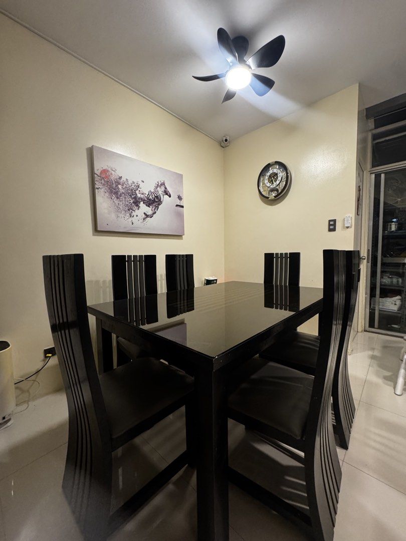 Modern Black Dining Table with 6 Chairs (Category: Tables & Sets) located in Quezon City. Submitted by cruzstephieee (Listing ID 1466333719, Image 1). Description: - black dining set including a table and six high-back chairs - Sturdy and solid construction for long-lasting durability - Comfortable seats upholstered in premium dark leatherette - Contemporary design perfect for modern dining rooms - Note: Pick-up only due to item size.