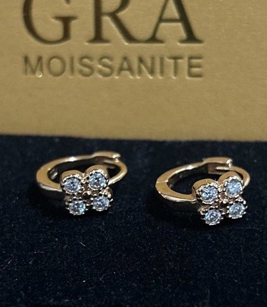 Moissanite Huggies Earrings (Category: Earrings) located in Marikina City. Submitted by decluttering.matters (Listing ID 1462394298, Image 1). Description: Moissanite earrings with clover design - Huggie hoop style - S925 - Silver setting in champagne gold color - Adorned with small moissanite stones - See photos for details FREE: dark red crystal necklace (new) No reservations. Payment first via GCash. First to pay gets the item. Shipping will b