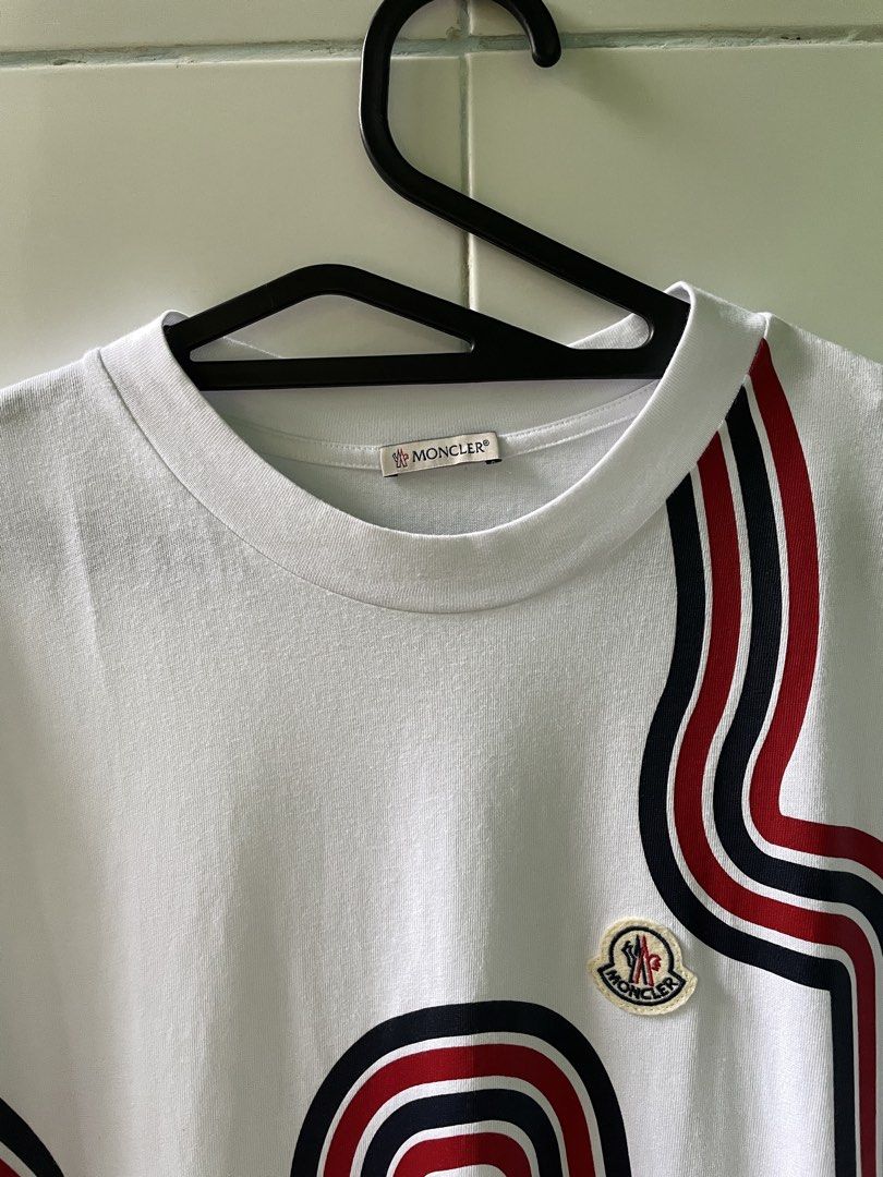 Moncler Tee (Category: Luxury Apparel) located in Liloy. Submitted by juan2thrift (Listing ID 1466245505, Image 2). Description: Moncler Racing Tee Condition - 9.5/10 Color rate - 10/10 Dimension - 22” by 29” Authentic Excellent to As new condition .