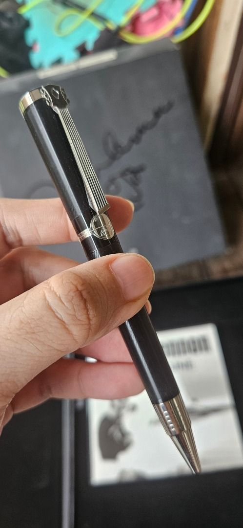 Montblanc John Lennon Special Edition Ballpoint Pen (Category: Luxury Accessories) located in Paranaque City. Submitted by negative_view (Listing ID 1466218021, Image 3). Description: - Authentic Montblanc John Lennon Special Edition ballpoint pen (Donaton Collection) - Striking black striped body with a unique guitar-shaped clip - Smooth and tested working twist mechanism - Complete collector's set including special box, service guide, book, and