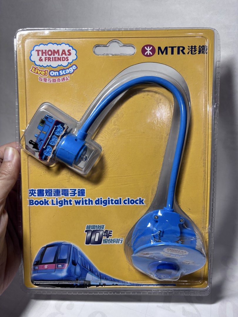 MTR Thomas & Friends Live On Stage Book Light (Category: Children's Books) located in Baguio. Submitted by 21enygrace.ph (Listing ID 1466247141, Image 1). Description: - Official MTR 10th anniversary Thomas & Friends merchandise - 2-in-1 design: Book light and digital clock with a convenient clip base - Flexible blue bendable neck featuring a cute Thomas train figure - Brand new and unopened in original blister packaging - Battery already include