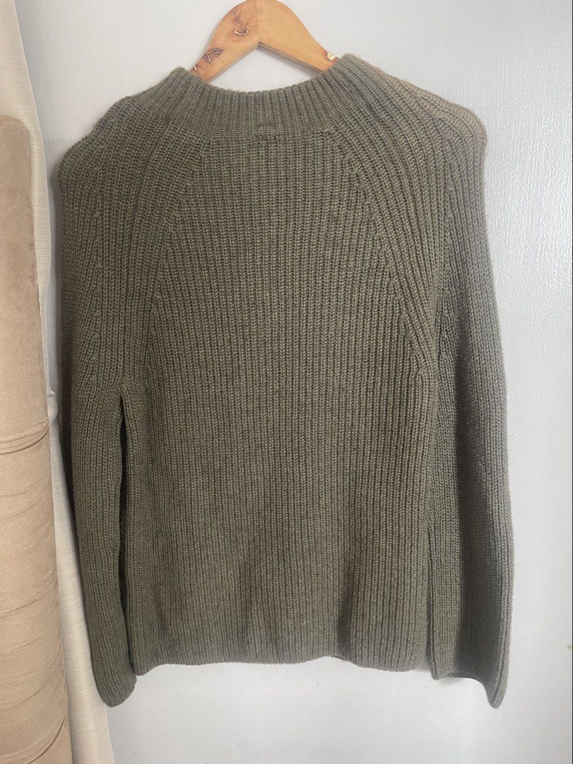 Muji Olive Green Yak Wool Sweater (Category: Longsleeves) located in Quezon City. Submitted by booktt (Listing ID 1466224437, Image 3). Description: with discoloration on shoulder from hanger storage muji yak blend very warm.