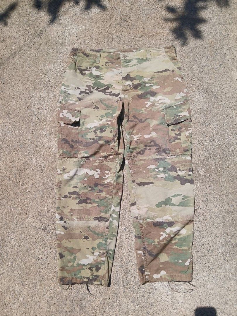 Multicam Camouflage Military Cargo Pants with Drawstring Cuffs (Category: Jeans) located in Mangaldan. Submitted by manuelingalla_3rd (Listing ID 1466296426, Image 1). Description: - Multicam camouflage pattern ideal for outdoor use and airsoft - Multiple side and back cargo pockets for convenient storage - Reinforced knees for enhanced durability in tough conditions - Adjustable drawstring leg openings designed to fit over boots - Sturdy cotton-
