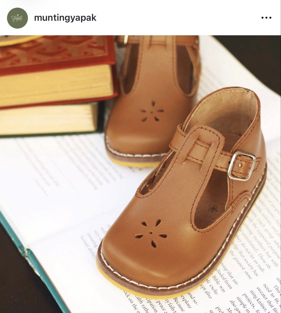 Munting Yapak Aurora Size 14 (Category: Babies & Kids Fashion) located in Manila. Submitted by annediwata (Listing ID 1466214288, Image 1). Description: - Brand: Munting Yapak. Still with Box Orig Price was 2099 - Model: Aurora Classic Brown Leather T-Bar Shoes - Details: Sweet floral cut-out on the toe and adjustable buckle strap - Inclusions: Original branded dust bag - Size: Size 14 please refer to Yapak Size.