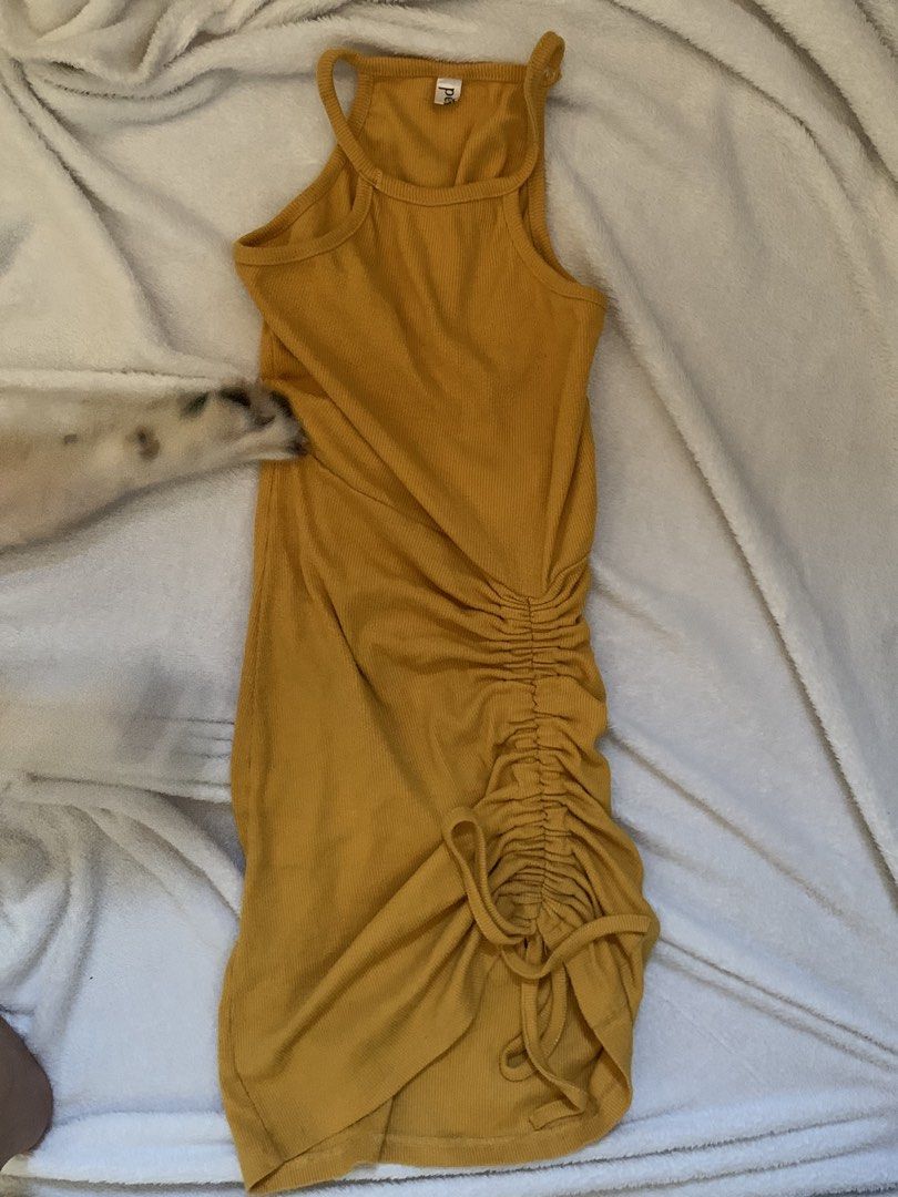MUSTARD RUCHED MINI DRESS (Category: Dresses) located in Manila. Submitted by shie333 (Listing ID 1466181446, Image 2). Description: Size: S Color: Mustard yellow Style: Sleeveless fitted mini dress Fabric: Ribbed / stretchy Detail: Side ruching with adjustable drawstring Fit: Fitted/bodycon Condition: Preloved, good condition Flaws: No major flaws noticed RFS: Decluttering / no longer used.