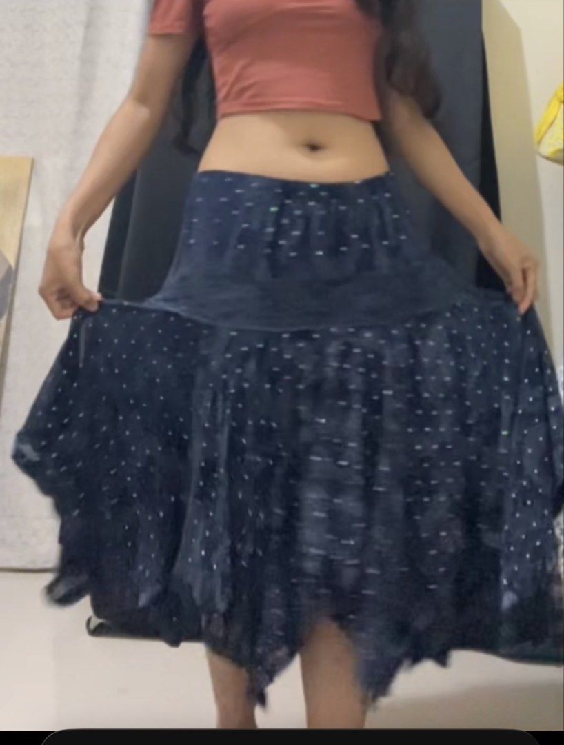 Navy Blue Flowy Boho Skirt with Silver Dots (Category: Skirts) located in La Trinidad. Submitted by potatothriftlip (Listing ID 1466301777, Image 1). Description: - Style: Dark blue midi skirt with all-over tiny silver dots - Design: Flowy, flared shape with layered ruffles near the hem - Fit: Comfortable mid-rise elastic waistband - Fabric: Lightweight and moves nicely when walking - Versatility: Great for casual days, beach trips, and pairing w