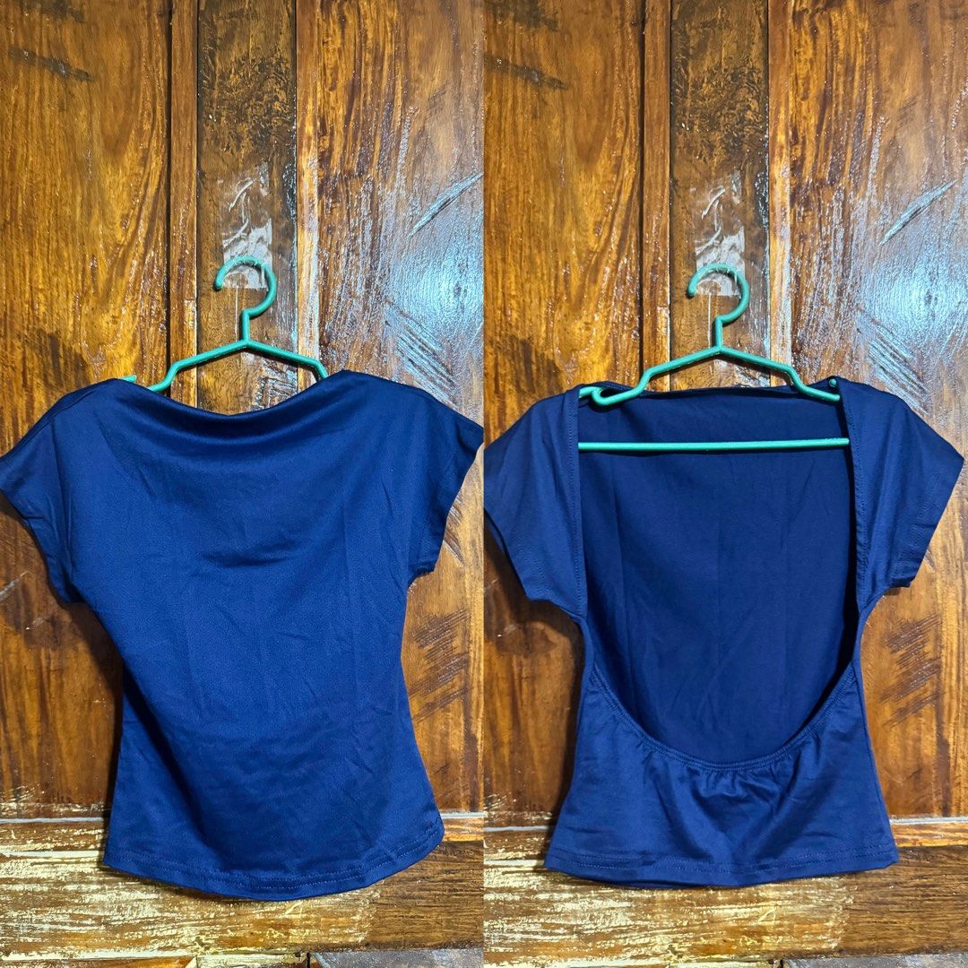 Navy blue open back short sleeve top (Category: Blouses) located in Kananga. Submitted by yongggi (Listing ID 1466320920, Image 1). Description: Solid navy blue slim-fit top featuring short sleeves, a low scoop back, and comfortable stretch fabric. Versatile for casual days or nights out..