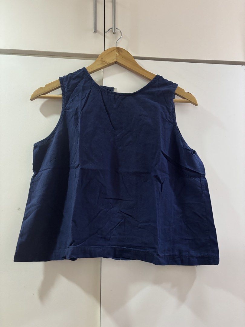 Navy Blue Sleeveless Crop Tank Top (Category: Sleeveless) located in Las Pinas. Submitted by misg0905 (Listing ID 1466203038, Image 1). Description: - Color: Solid navy blue - Design: Sleeveless, round neckline, boxy cropped cut - Material: Lightweight and easy to match with high-waisted jeans or skirts - Condition: Worn a few times, no stains or rips - Care: Machine washable.