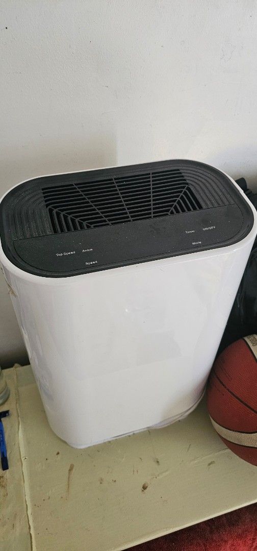 Negative Ion Air Purifier White (Category: Air Purifiers & Dehumidifiers) located in Manila. Submitted by anthonylee23810 (Listing ID 1466297610, Image 1). Description: Negative ion air purifier in white housing. Runs on 110V/220V with 35W/45W rated power. Weighs 4.5kg. Recommended for areas between 30 and 50 square meters. Top control panel includes buttons for On/Off, Timer, Mode, Anion, and Speed settings. Standard upright standing design with