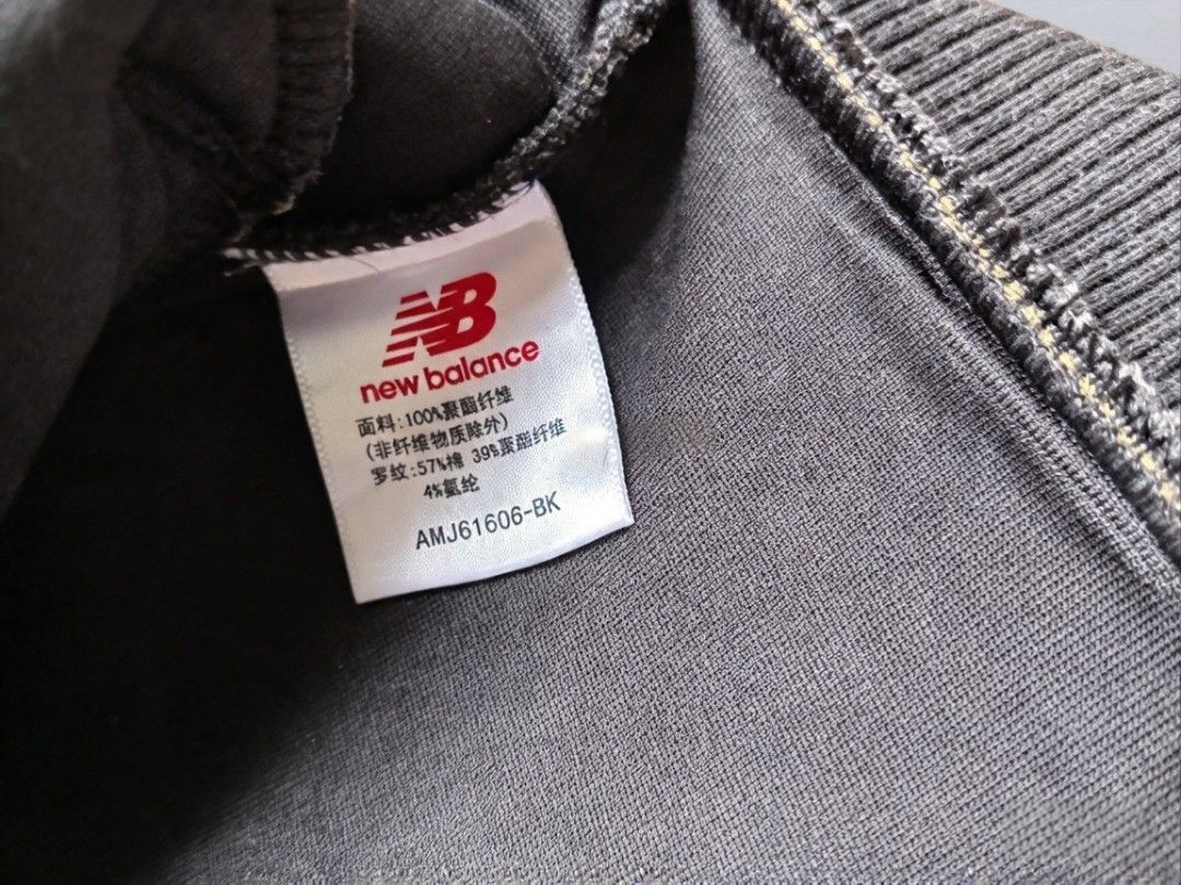 New Balance Bomber Jacket AMJ61606-BK Size L (Category: Coats, Jackets and Outerwear) located in Manila. Submitted by nisayy13 (Listing ID 1466241602, Image 3). Description: - Brand: New Balance - Style: Bomber jacket with snap button closure - Color: Black with large white NB chest branding and back logo - Size: Large - Pockets: Two front welt pockets - Details: Ribbed collar, cuffs, and hem - Origin: Made in China - Condition: Brand new.