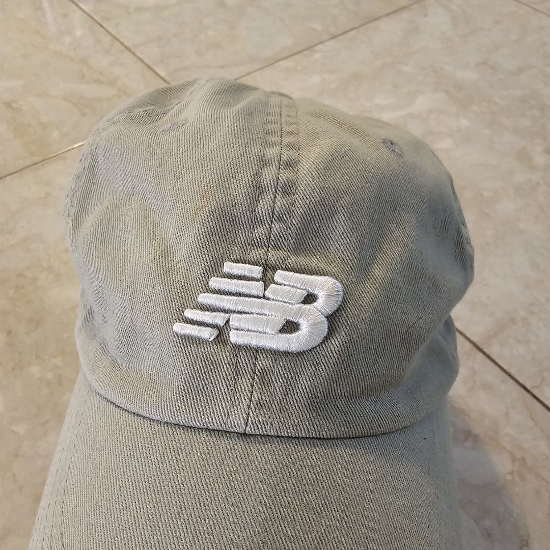 New Balance Grey Cap (Category: Caps & Hats) located in Tagaytay City. Submitted by jesssipreloved (Listing ID 1466254939, Image 3). Description: Grey New Balance dad cap with embroidered white logo on the front. Classic six-panel construction with breathable eyelets. Adjustable strapback closure in the back. Made from 100% cotton material. Interior taped seams feature branded New Balance lettering. Clean wash tag attached inside. DM for more inf