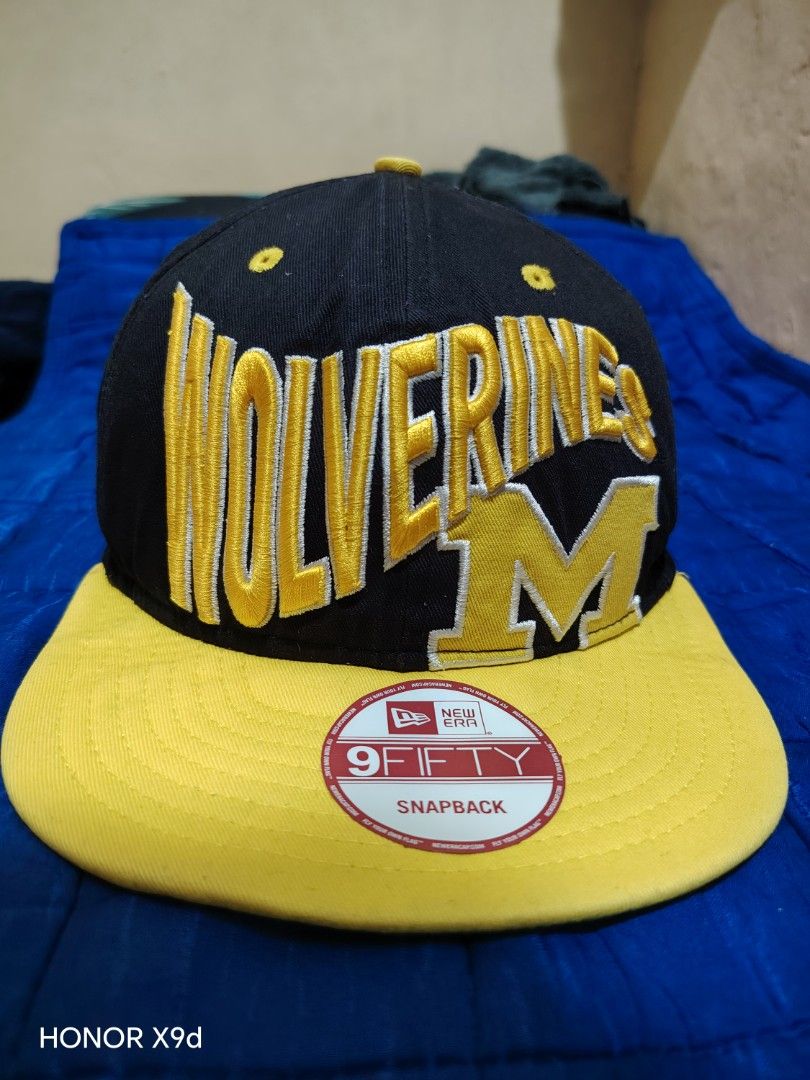New Era 9FIFTY Wolverines Michigan Snapback Hat (Category: Caps & Hats) located in Manila. Submitted by thugluvin85 (Listing ID 1466196077, Image 2). Description: - Brand: New Era 9FIFTY Snapback - Team: Michigan Wolverines (Classic M logo embroidery) - Color: Black with vibrant yellow accents - Fit: Adjustable yellow snapback closure - Details: Embroidered side flag, structured crown with eyelets for ventilation - Condition: Brand new with origi